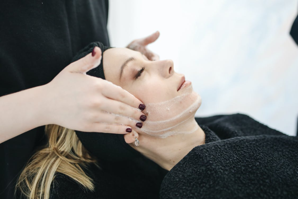 a woman getting a facial cleansing treatment
